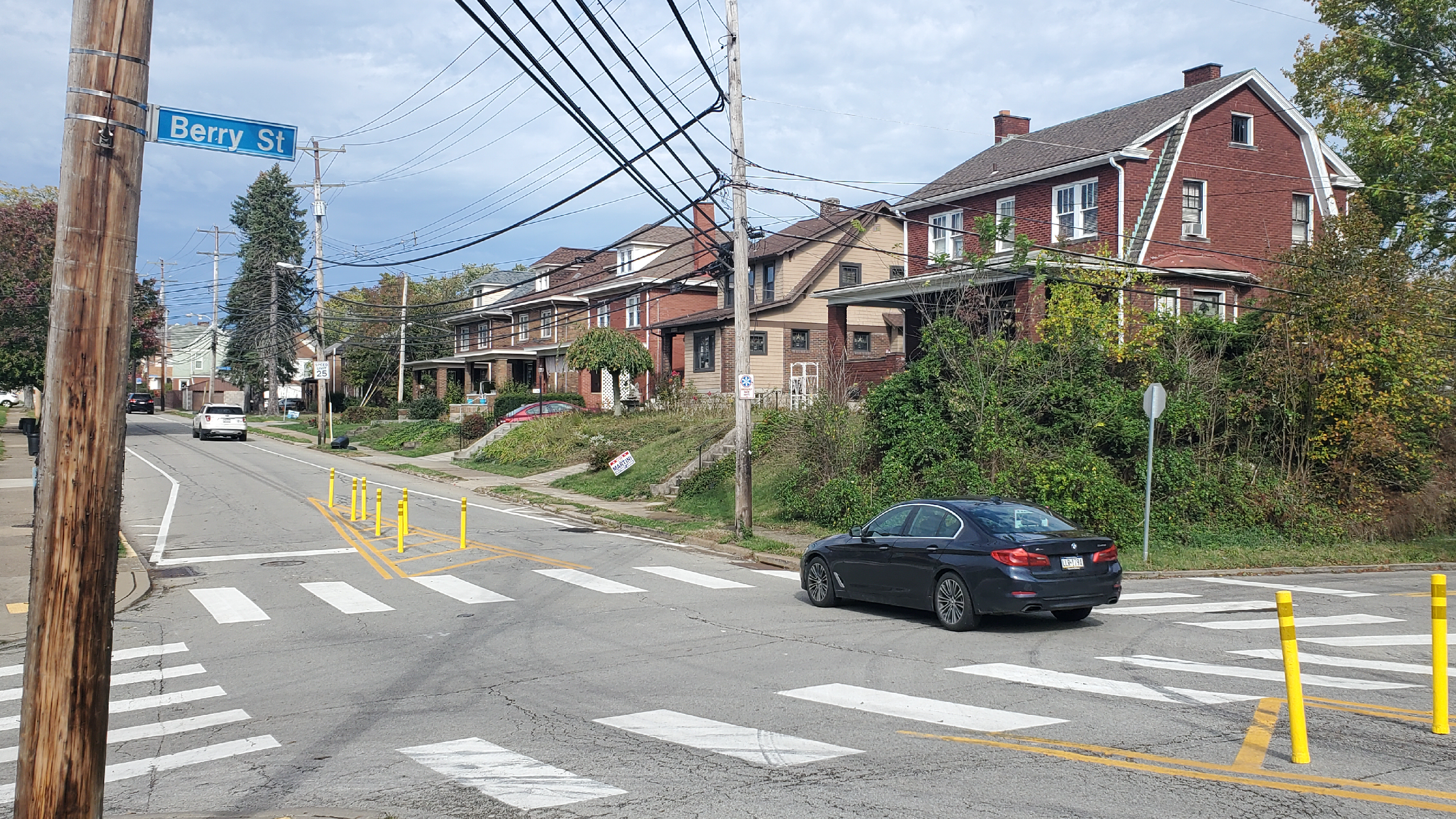 Image of a splitter island, made with yellow paint and flex posts, between two lanes