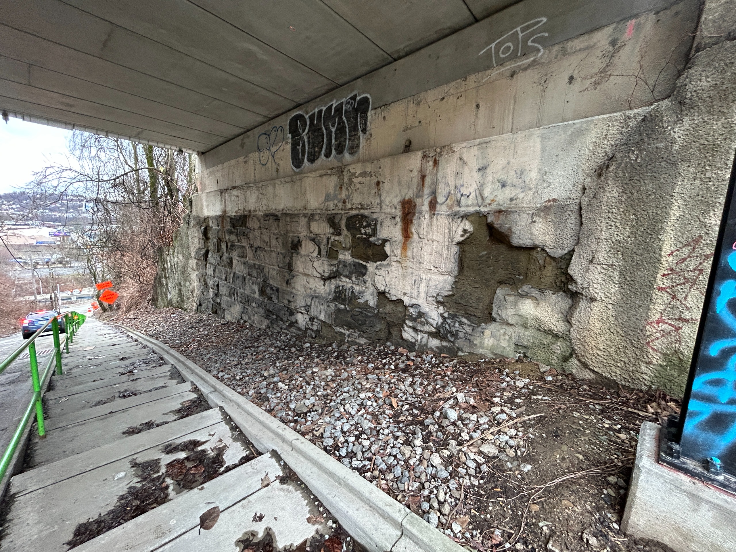 Deteriorated sandstone at Lowrie St. Bridge abutments